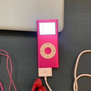 Ipod nano 4G, charging cord, earphones and over 300 songs down loaded.